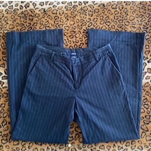 Fashionable black stripped dress pants.